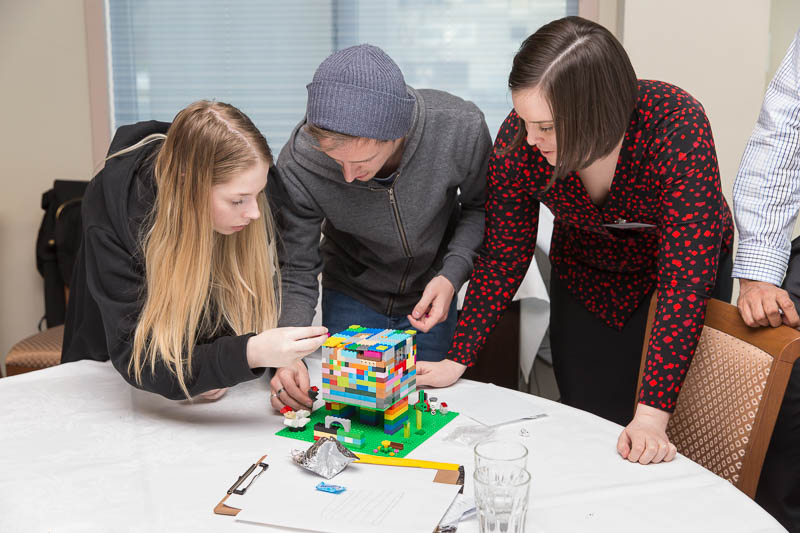 ICT apprentices, cadets and grads build models out of lego at this year's networking day.