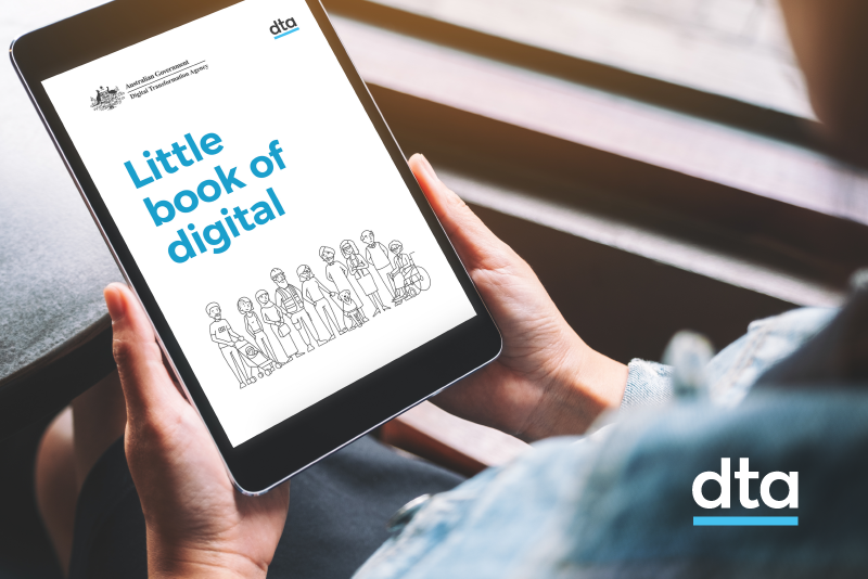 A person holding the Little Book of Digital on a tablet screen.