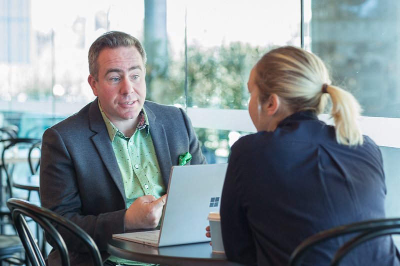 Andy Kempson having coffee with an ICT entry-level program participant.